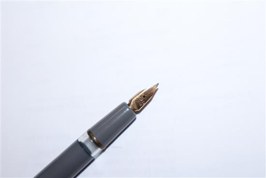 A Mont Blanc 252 grey finish fountain pen and propelling pencil set, cased and a Caran DAche silver ballpoint pen